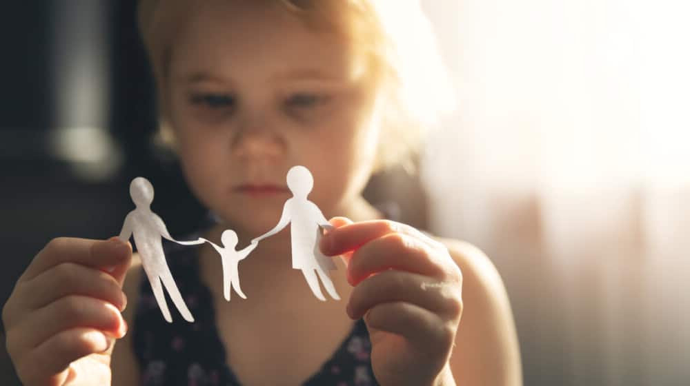 Child Holding Family Cutout